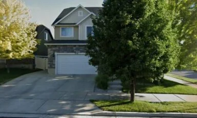 Two-story home with an attached garage in South Jordan, Utah